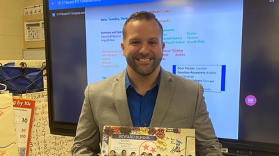 Dustin Smith Holding Thank You Poster From Students Photo